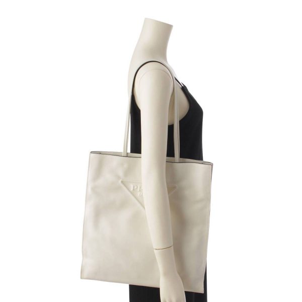 re pra to w 00197 7 Prada Triangle Leather Embossed Tote Bag White