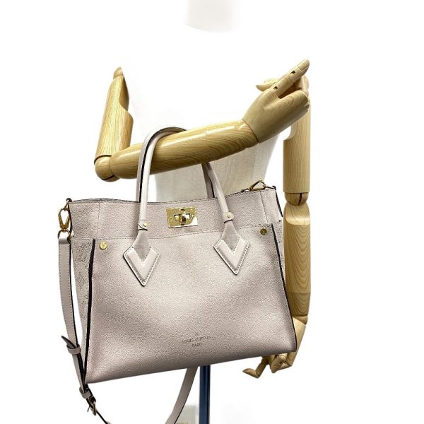 z0005190 9 LOUIS VUITTON M55802 On My Side Mahina Handbag Beige