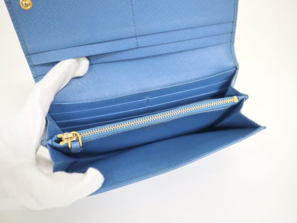 2000234256100042 5 Prada biflong wallet ribbon saffiano blue 1MH132