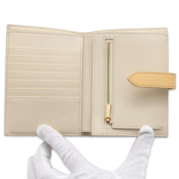 9645844 04 Celine Pebble Medium Strap Wallet Off White