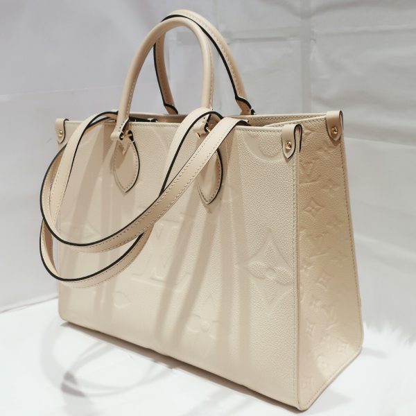 t2403 06 001694tt 07 Louis Vuitton On the Go MM Monogram Empreinte Ivory Tote Bag Handbag