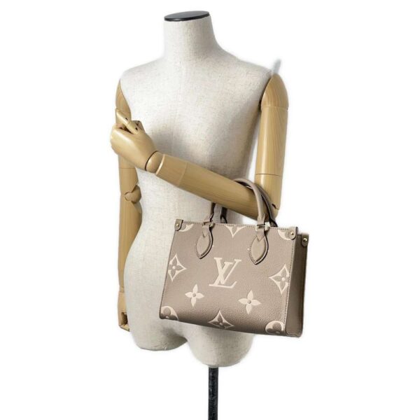 9458994 04 Louis Vuitton On The Go PM Monogram Empreinte Handbag Bicolor