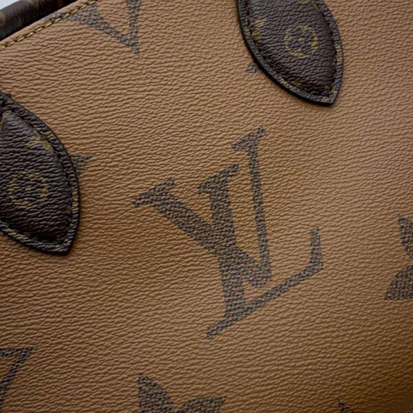 9603134 09 Louis Vuitton On The Go PM Monogram Reverse Handbag