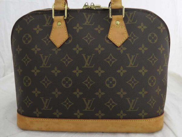 e51994a 1 Louis Vuitton Alma Monogram Canvas Handbag Brown