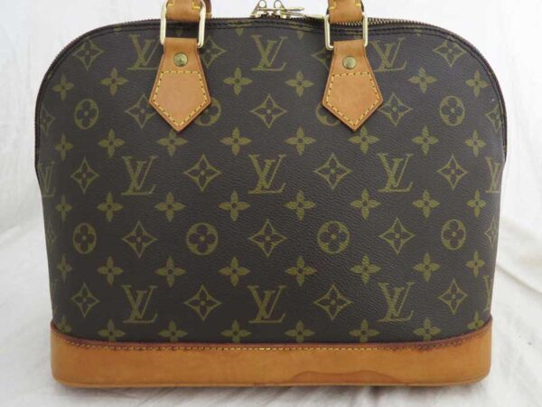 e52698a 1 Louis Vuitton Alma Monogram Canvas Handbag Brown