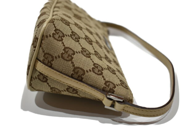 imgrc0076856683 Gucci GG Canvas Accessory Pouch Beige