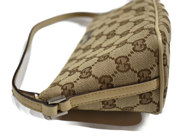 imgrc0076856684 Gucci GG Canvas Accessory Pouch Beige