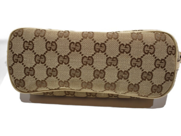 imgrc0076856686 Gucci GG Canvas Accessory Pouch Beige