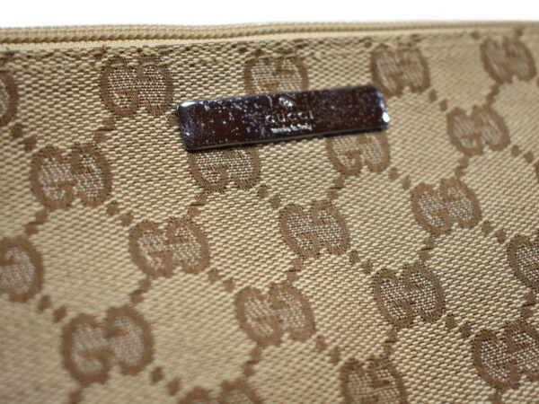 imgrc0076856687 Gucci GG Canvas Accessory Pouch Beige