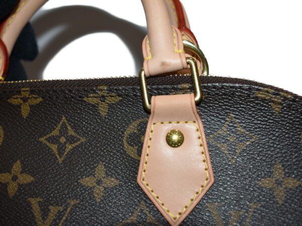 imgrc0079395955 Louis Vuitton Alma Monogram Canvas Handbag Brown