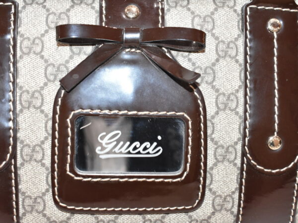 imgrc0079648788 Gucci GG Supreme Mini Bag Brown