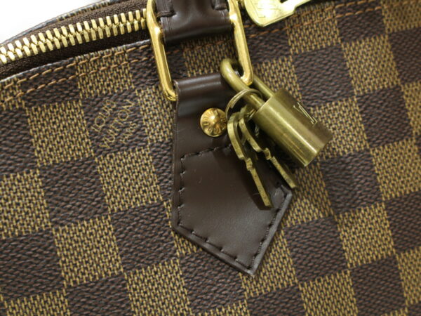 imgrc0091289954 Louis Vuitton Alma Damier Ebene Handbag Brown