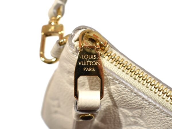 imgrc0093947935 Louis Vuitton Empreinte Pouch Mini Handbag White