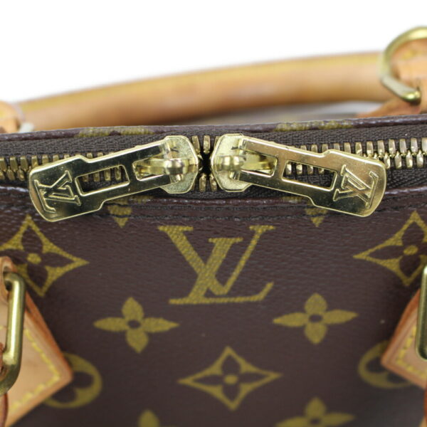 imgrc0099226196 Louis Vuitton Alma Monogram Canvas Handbag Brown