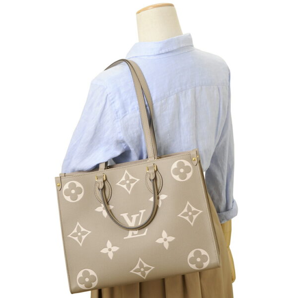 lv45494 4 Louis Vuitton On the Go MM Empreinte Tote Bag Beige