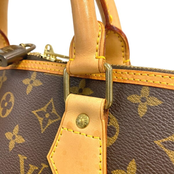 z0007139 10 Louis Vuitton Alma Voyage Monogram Handbag Brown