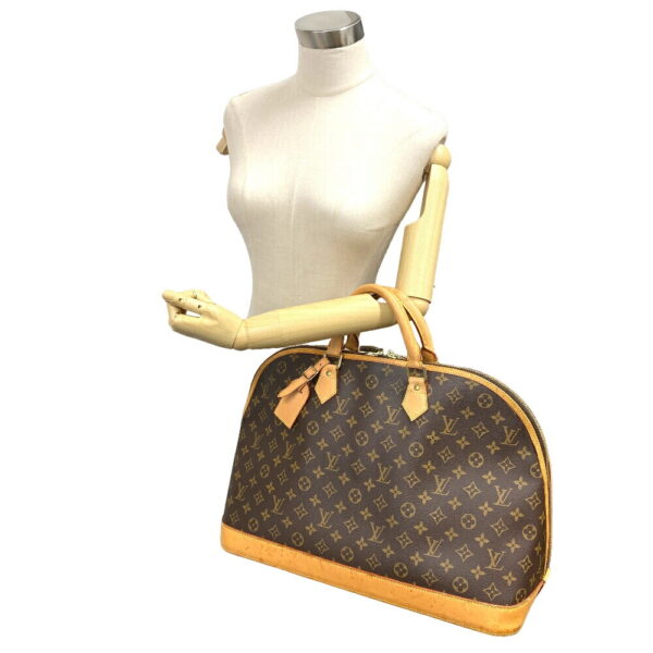 z0007139 15 Louis Vuitton Alma Voyage Monogram Handbag Brown