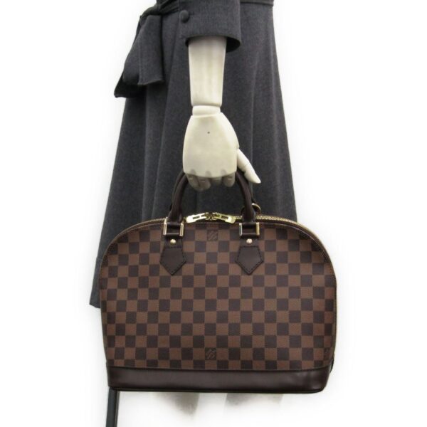 147321 170 11 Louis Vuitton Damier Alma Handbag Ebene