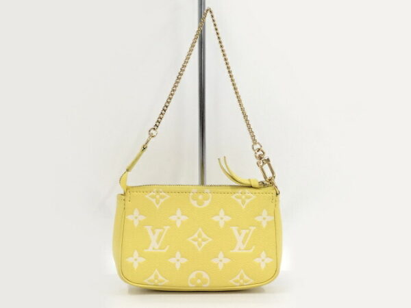 2000803252000694 2 Louis Vuitton Pochette Accessoire Mini Pouch Empreinte Yellow