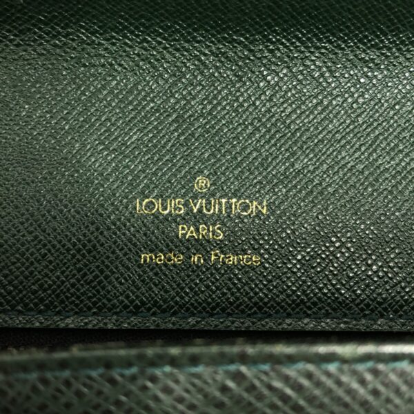 37319679 7 Louis Vuitton Pochette Clad Bag Taiga Leather Epicea