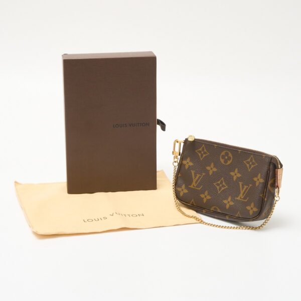 compass1711338913 Louis Vuitton Mini Pochette Accessoire Pouch Monogram Leather Brown