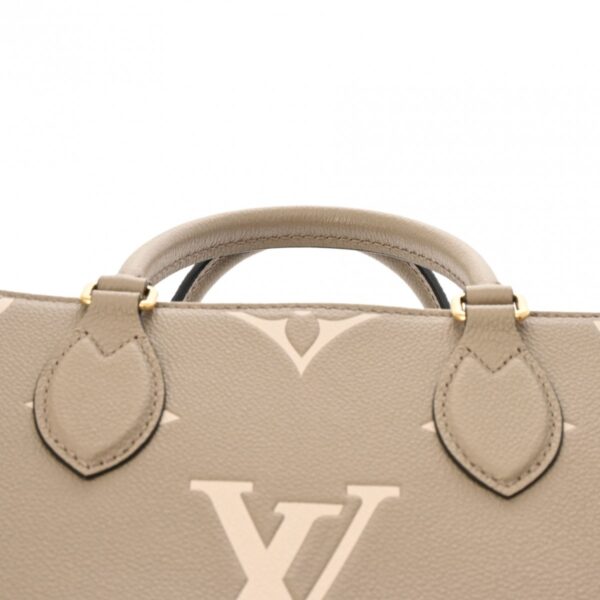 ik 00 0611900 5 Louis Vuitton Bicolor Empreinte On the Go PM 2WAY Tourtrail Creme