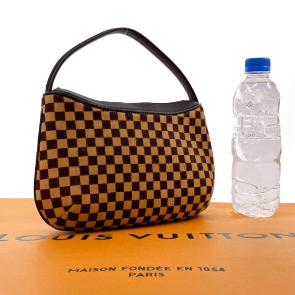 n3081855 2 Louis Vuitton Tiger Teagle Handbag Damier Sauvage Brown